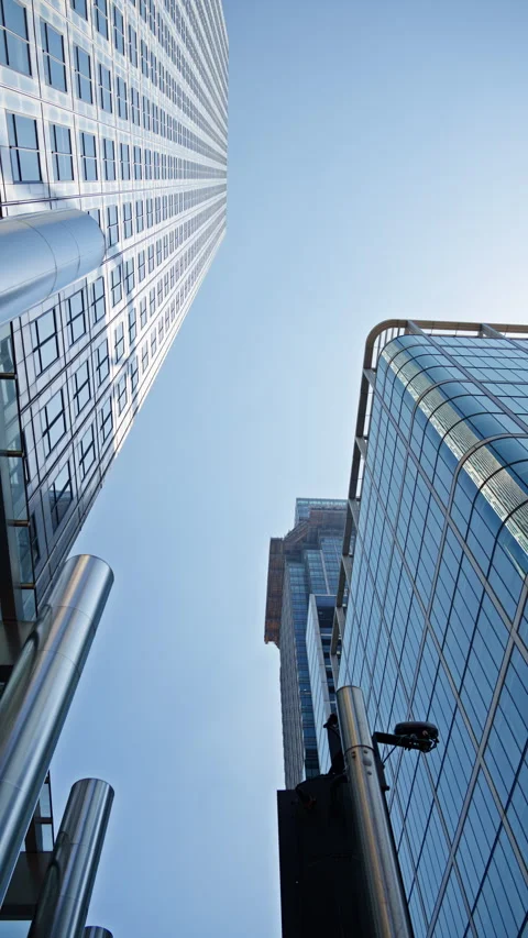 Low angle view of a modern glass One Canada Square office buildings in Canary Stock Footage 315544249