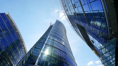 Low angle view of modern glass skyscrapers in a financial district Stock Footage 345138937