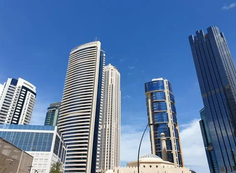 Low angle view of modern glass skyscrapers and corporate office towers  Foto stock