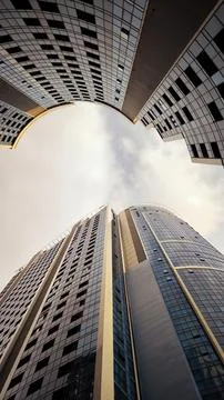 Low angle view of modern glass skyscrapers reaching towards the sky. Stock Photos