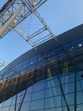 Low-angle view of modern glass building facade Stock Photos