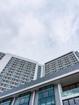 Low-angle view of a modern high-rise building with a glass facade Stock Photos