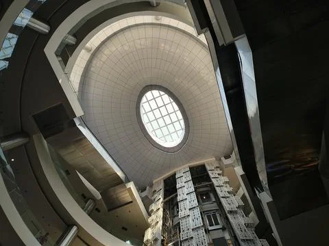 Low angle view of modern mall atrium ceiling with oval skylight Stock Photos
