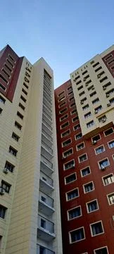 Low Angle View of Modern Multi Story Residential Buildings Under Blue Sky Stockfoto's