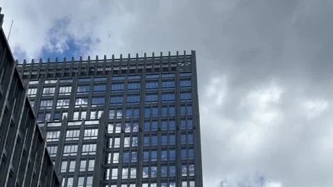 Low Angle View of Modern Office Building Against Dramatic Sky 스톡 동영상 334358206