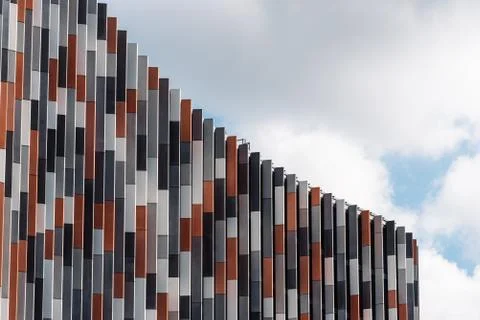 Low angle view of modern office building against sky Stock Photos