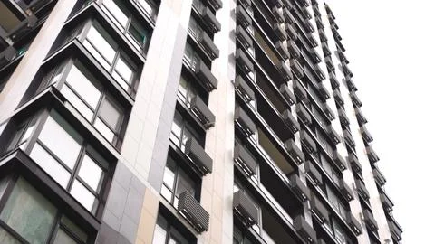 Low angle view of modern office building in downtown. Slow motion Stock Photos