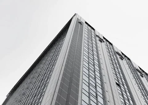 Low angle view of a modern office building facade. Monochrome high rise Stock Photos