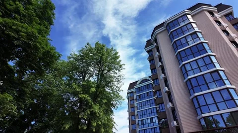 Low angle view of a modern residential building facade on a clear sunny day. Video stock 336948785