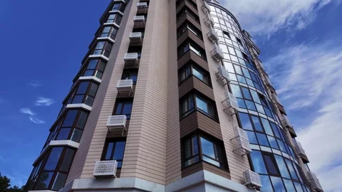 Low angle view of a modern residential building facade on a clear sunny day. Video stock 336948787
