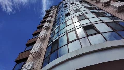 Low angle view of a modern residential building facade on a clear sunny day. Video stock 336948807