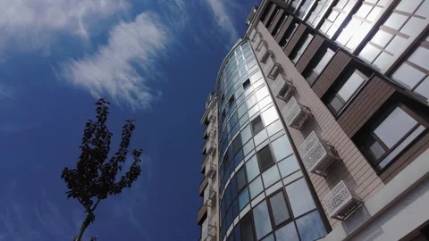 Low angle view of a modern residential building facade on a clear sunny day. Video stock 336948825