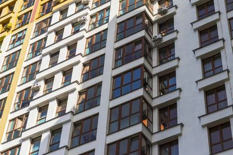 Low angle view of modern residential apartment building facade. Urban Stock Photos