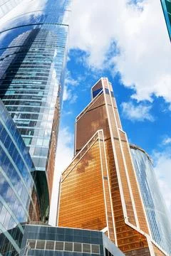 Low angle view of modern skyscrapers against blue sky. Reflective skyscrape.. Stock Photos
