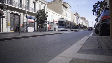Low angle view of modern tramway going by Rue de Rome in Marseille Stock Footage 106246701