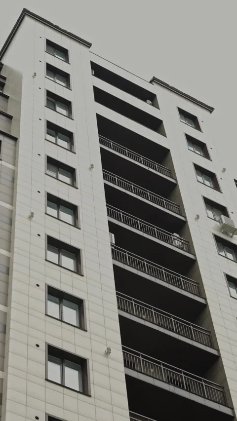 Low-angle view of a modern white residential building facade Stock Footage 335471968