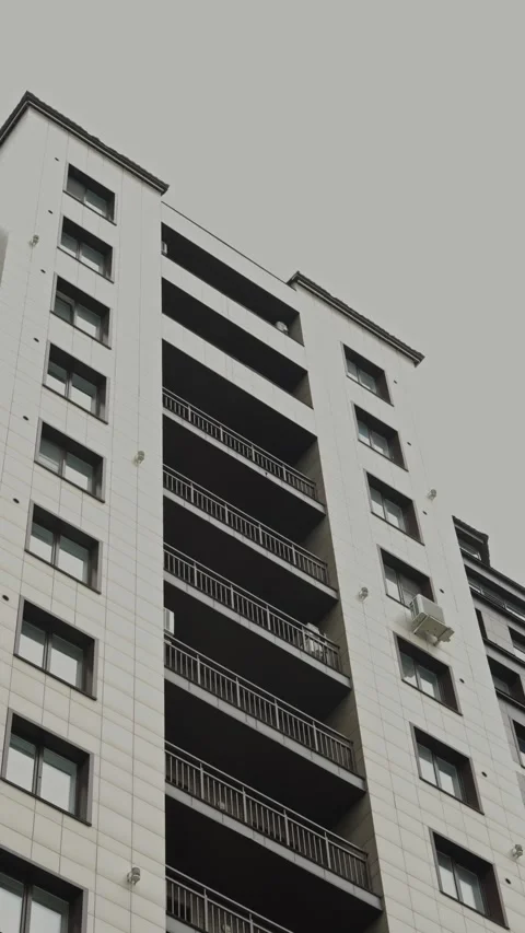 Low-angle view of a modern white residential building facade Stock Footage 335471992