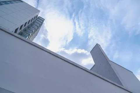 Low angle view of modern white building under the beautiful morning blue sky Stock Photos