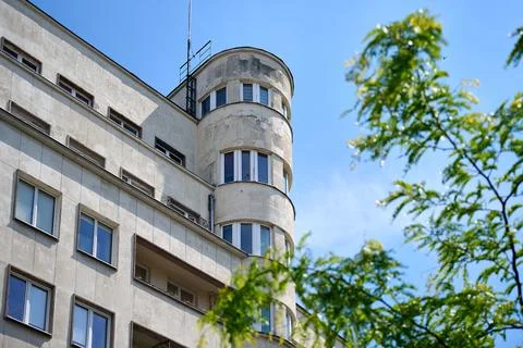 Low angle view of modernist architecture corner apartment building with round Stock Photos