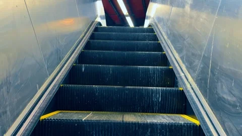 Low angle view of moving metal escalator stairs in subway station Stock Footage 332045005