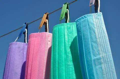 Low angle view of multi colored surgical face mask (Disposable mask)  Stock Photos