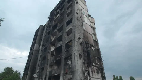 Low-angle view of multi-storey building, burnt by armed troops Stock Footage 230224179