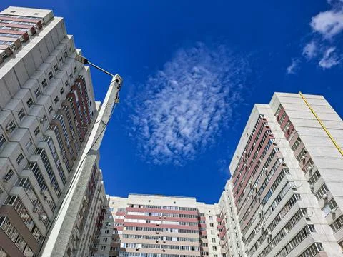 Low angle view of multi story apartment buildings made of white brick under.. Fotos de archivo