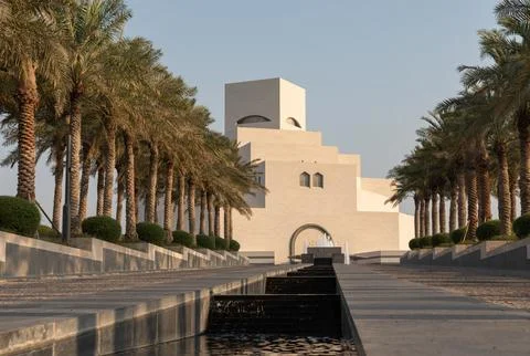 Low angle view of Museum of Islamic Art in Doha Qatar with water fountain  Photos