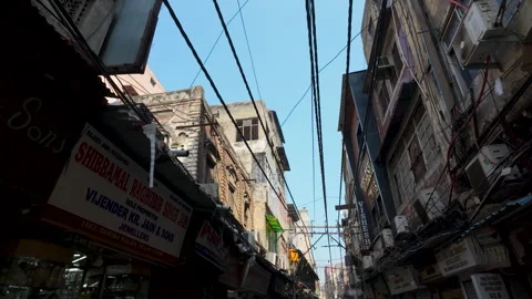 Low Angle View Of Narrow Street With Tangled Wires In Old Delhi India Stock Footage 346272535