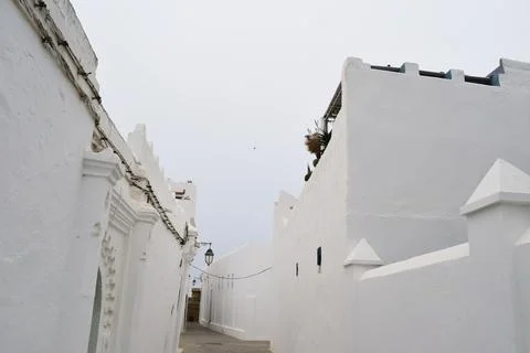 Low Angle View of Narrow Whitewashed Alley in Mediterranean Village Stock Photos