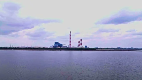 Low angle view of National Thermal Power Corporation with Almatti Dam water and Vidéo 348692480