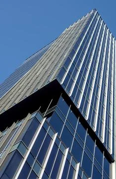 Low-angle view of Neptun Office Center glass facade, Gdansk, Poland. Stock Photos