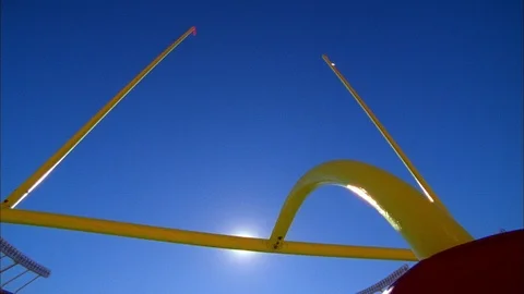 Low angle view of NFL goal against the bright sunlight Stock Footage 113275380