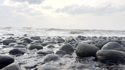 Low Angle View of Ocean Waves Over Rocky Beach Video stock 311533456