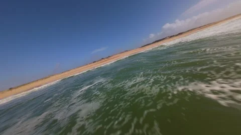 Low-angle view of ocean waves rolling onto sand Stock Footage 345061265