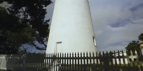 Low angle view of Ocracoke lighthouse surrounded with fence Stock Footage 103490339
