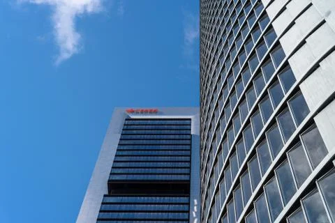 Low angle view of office building in the city of Madrid against blue sky Stock Photos