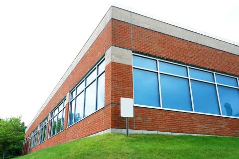 Low angle view of office building corner exterior Stock Photos
