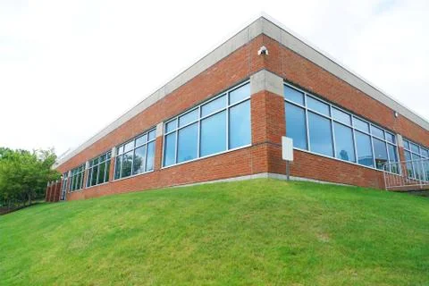 Low angle view of office building corner exterior Stock Photos