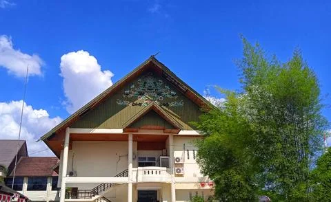 Low angle view of office building and clear blue sky background Stock Photos