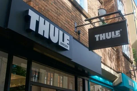 Low-angle view of the official Thule Sweden brand signage and hanging banne.. Stock-Fotos