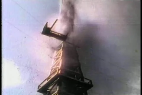 Low angle view oil gushing from derrick Stock Footage 11349249