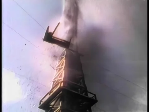 Low angle view oil gushing from derrick Stock Footage 260249114