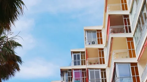 Low angle view to old apartment building balconies and windows with awning 動画素材 151109150