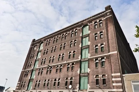 Low angle view to the old brick factory building Stock Photos