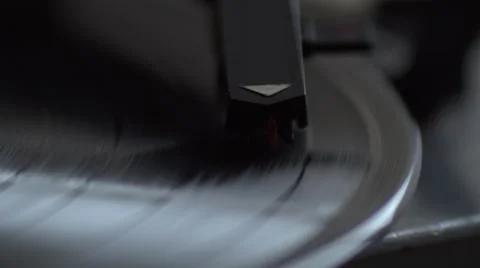 Low angle view of old fashioned turntable playing a track from black vinyl. Video stock 68934416