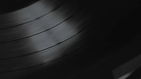 Low angle view of old fashioned turntable playing a track from black vinyl. Stock Footage 68934482