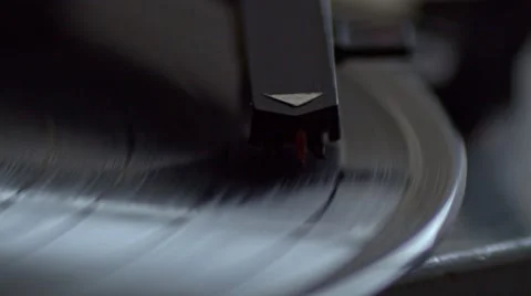 Low angle view of old fashioned turntable playing a track from black vinyl. Video stock 68934800