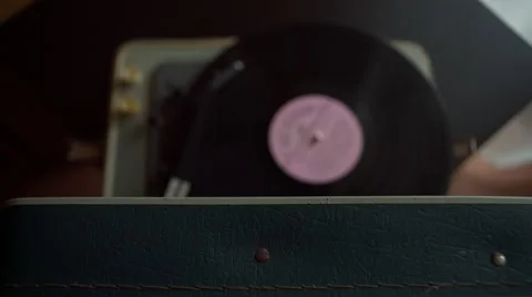 Low angle view of old fashioned turntable playing a track from black vinyl. Video stock 68934925