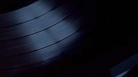 Low angle view of old fashioned turntable playing a track from black vinyl. Stock Footage 68934927